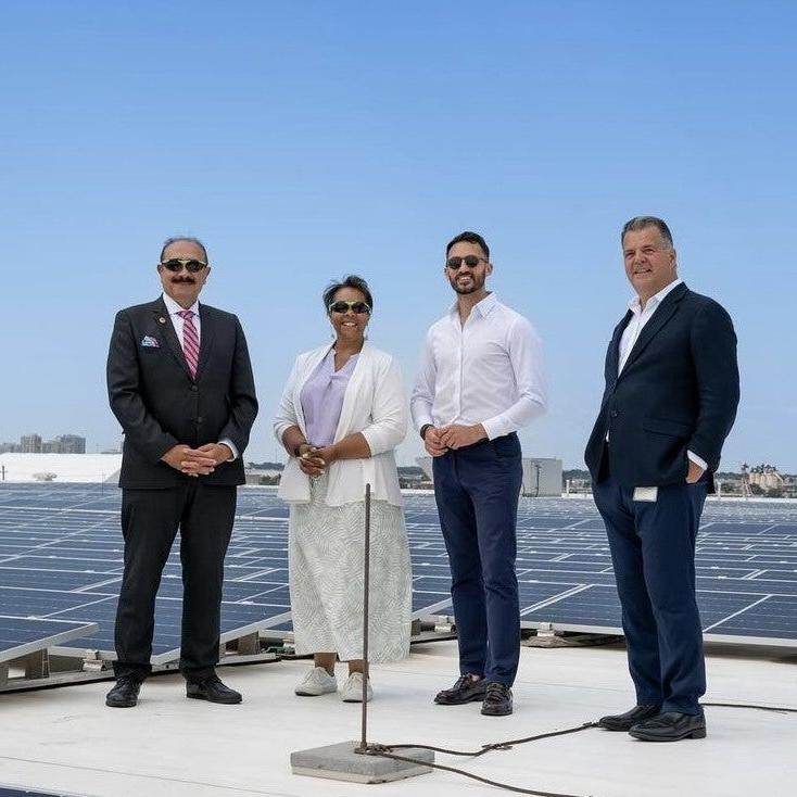 group photo with solar panels